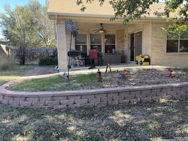 exterior space with ceiling fan and a patio area