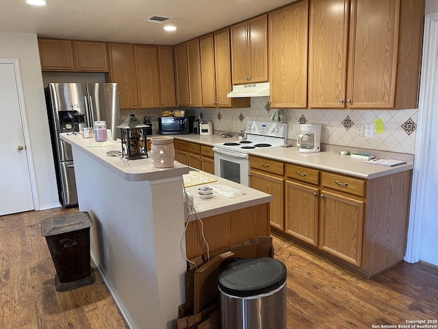 kitchen featuring dark wood-type flooring, stainless steel fridge with ice dispenser, a kitchen island, white range with electric stovetop, and backsplash