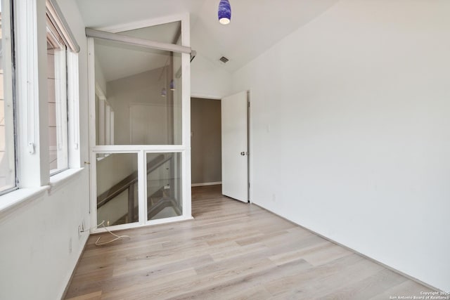 12519 Elm Manor St, San Antonio, TX 78230 - unfurnished room featuring wood finished floors and lofted ceiling