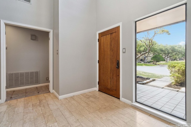 12519 Elm Manor St, San Antonio, TX 78230 - foyer with a towering ceiling, light wood-style floors, and baseboards
