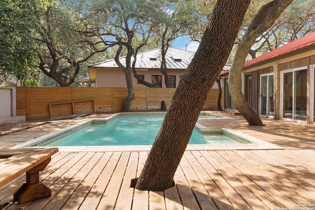 12519 Elm Manor St, San Antonio, TX 78230 - view of swimming pool with a wooden deck, a fenced backyard, and a hot tub