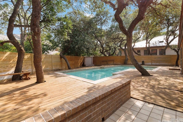 12519 Elm Manor St, San Antonio, TX 78230 - view of pool featuring a wooden deck and a fenced backyard