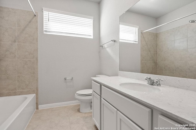 full bathroom with vanity, tiled shower / bath combo, tile patterned floors, and toilet