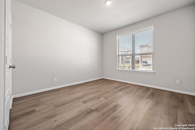 empty room featuring light hardwood / wood-style floors