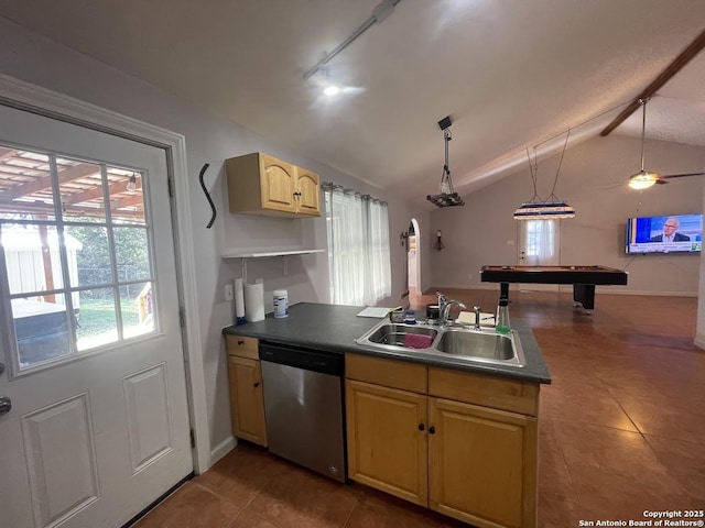 kitchen featuring pendant lighting, dishwasher, vaulted ceiling, and dark tile patterned floors