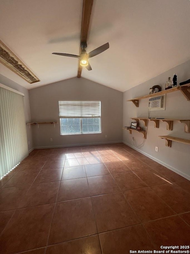 tiled empty room with vaulted ceiling with beams and ceiling fan