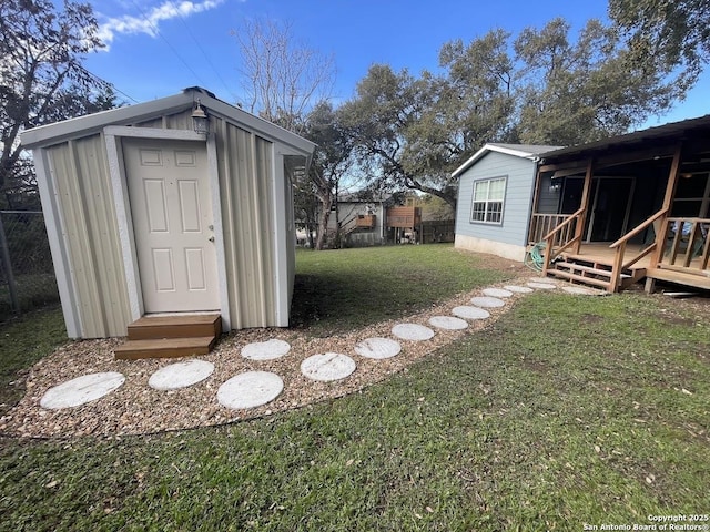 view of outbuilding featuring a lawn