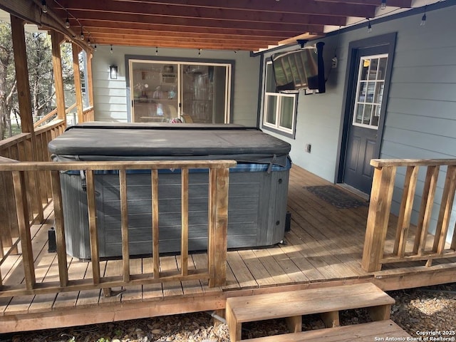 deck with a hot tub