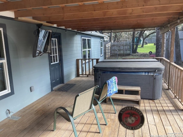 wooden deck with a hot tub