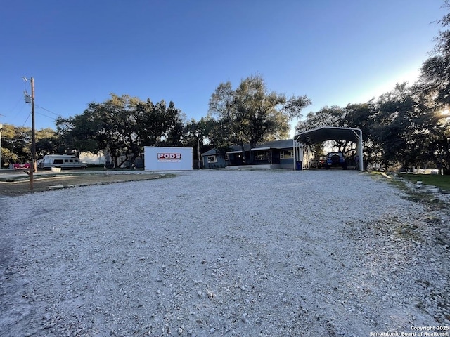 view of front of property featuring a carport