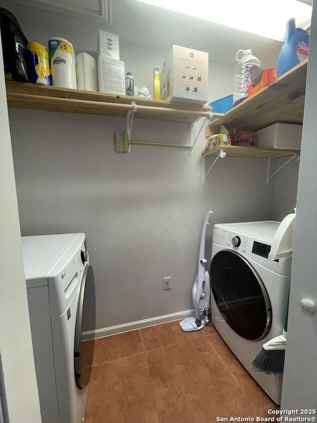 clothes washing area with washer and dryer