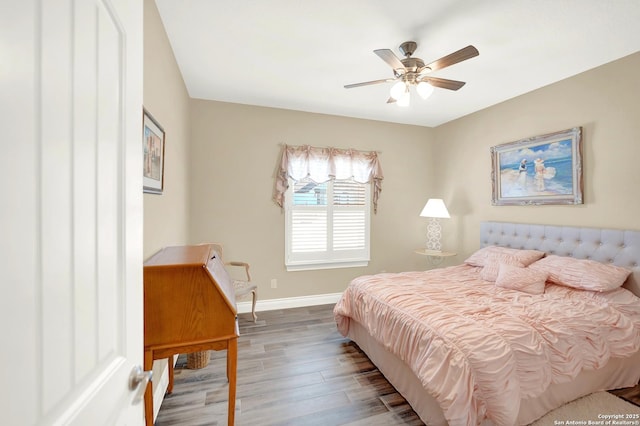 bedroom with ceiling fan and wood-type flooring