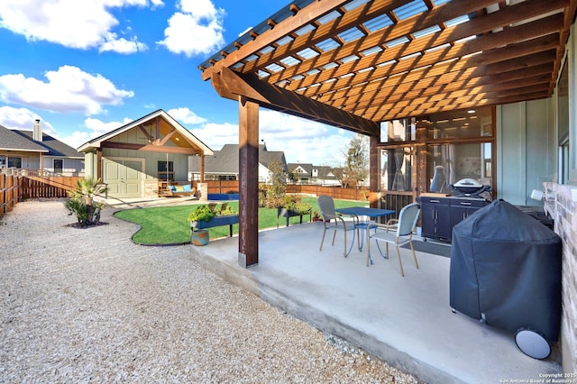 view of patio featuring an outbuilding, area for grilling, and a pergola