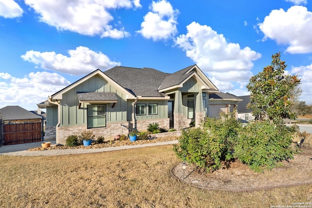 craftsman-style house with a front yard