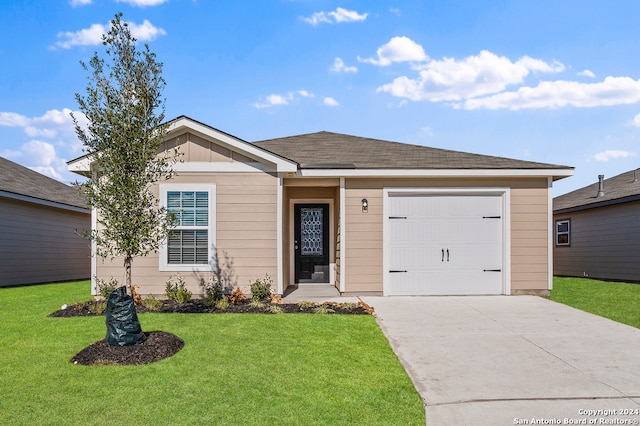 ranch-style house with a garage and a front lawn