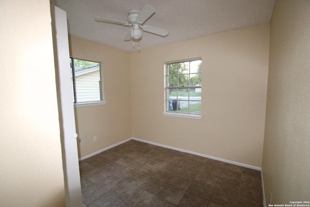 unfurnished room with ceiling fan