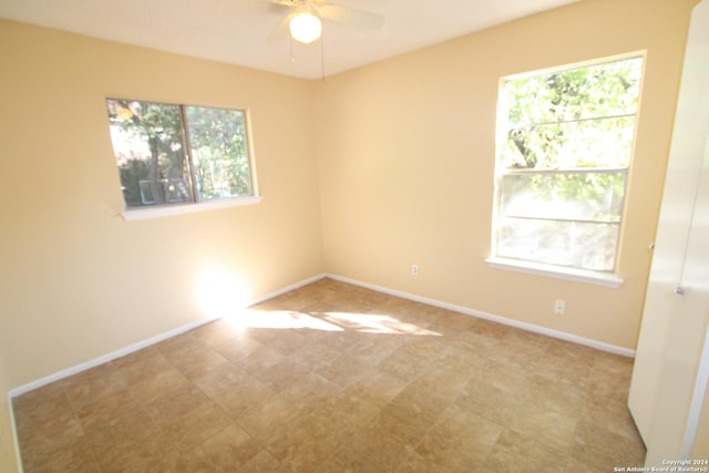 spare room with ceiling fan