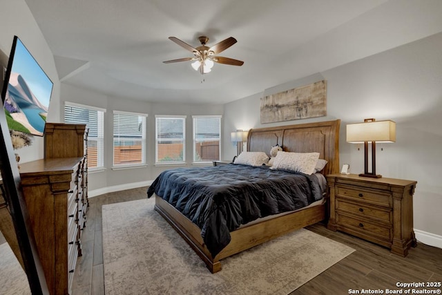 bedroom with hardwood / wood-style floors and ceiling fan