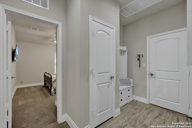 hallway featuring light hardwood / wood-style flooring