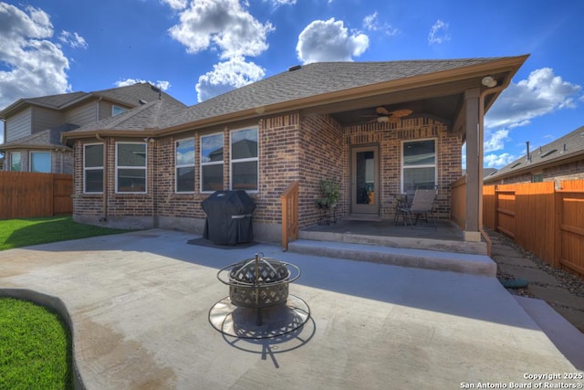 back of house with a patio area, ceiling fan, and an outdoor fire pit