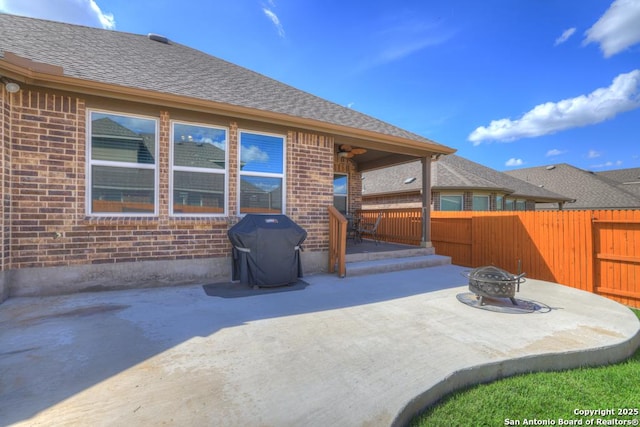 view of patio featuring a grill and a fire pit