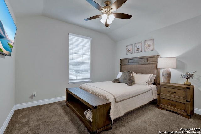 carpeted bedroom featuring lofted ceiling and ceiling fan