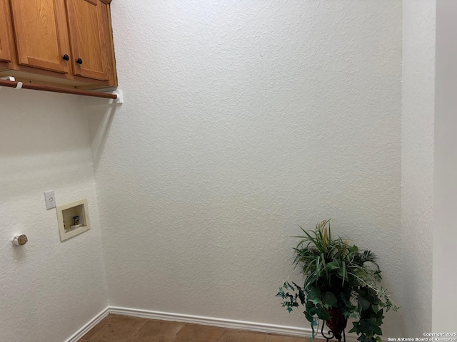 laundry room featuring cabinets and washer hookup