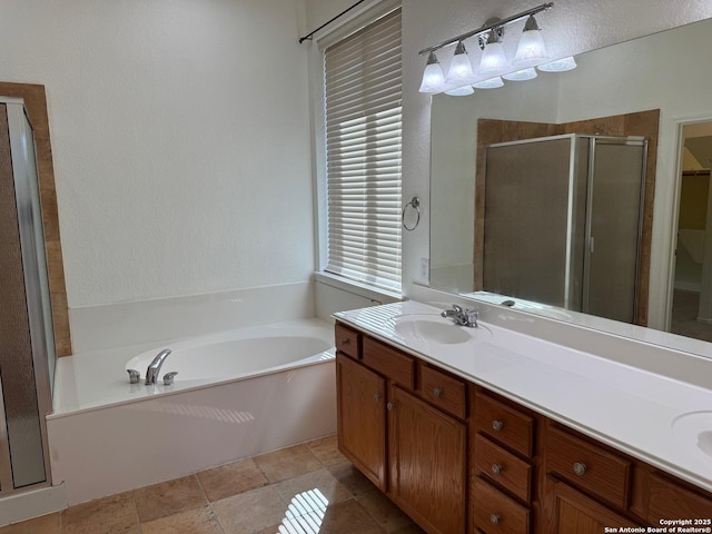 bathroom with vanity, plus walk in shower, tile patterned flooring, and a wealth of natural light