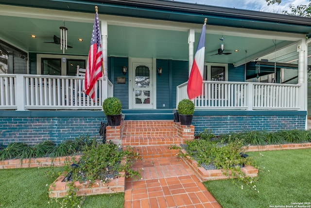 doorway to property featuring ceiling fan and covered porch