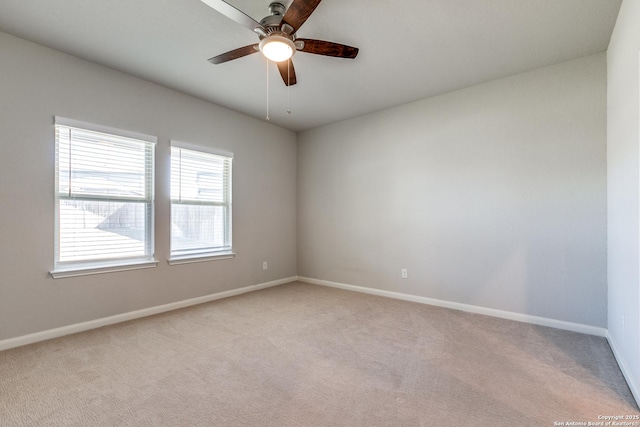 empty room with light carpet and ceiling fan