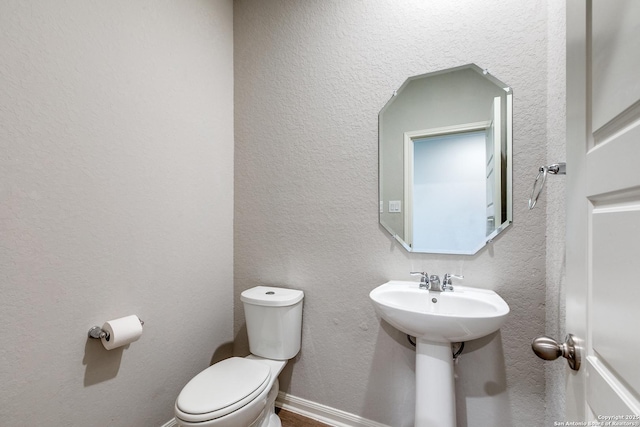 bathroom featuring toilet