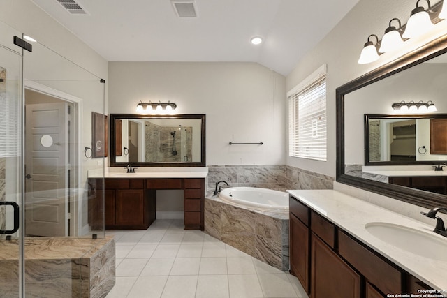 bathroom featuring tile patterned floors, vanity, shower with separate bathtub, and lofted ceiling