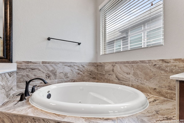 bathroom with a relaxing tiled tub