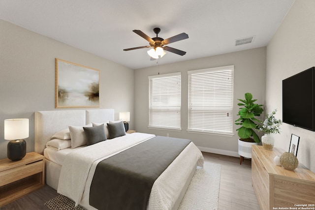 bedroom featuring hardwood / wood-style flooring and ceiling fan