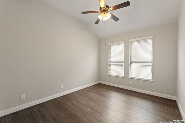 unfurnished room featuring lofted ceiling, dark hardwood / wood-style floors, and ceiling fan