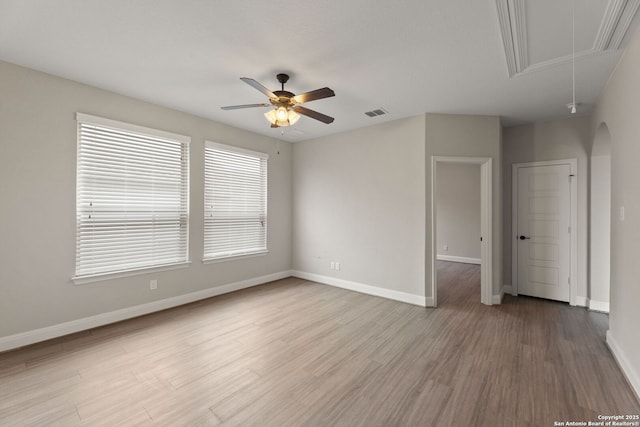 spare room featuring hardwood / wood-style floors and ceiling fan