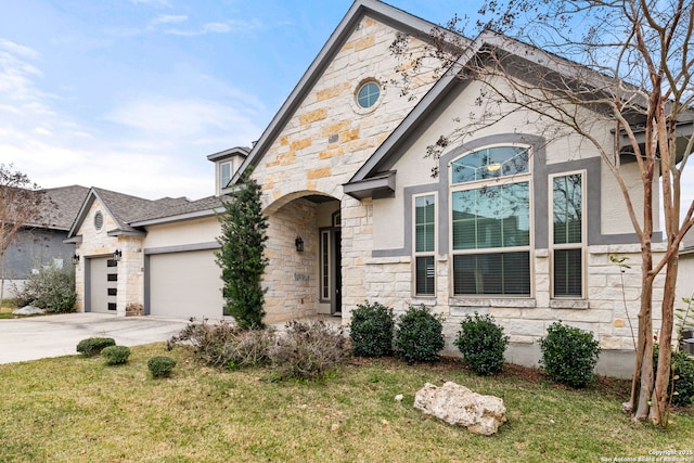 view of front of home with a garage and a front lawn