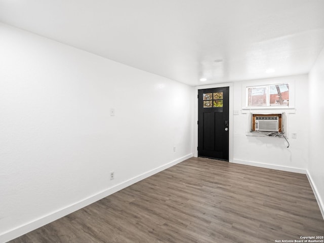 foyer with dark hardwood / wood-style flooring and cooling unit