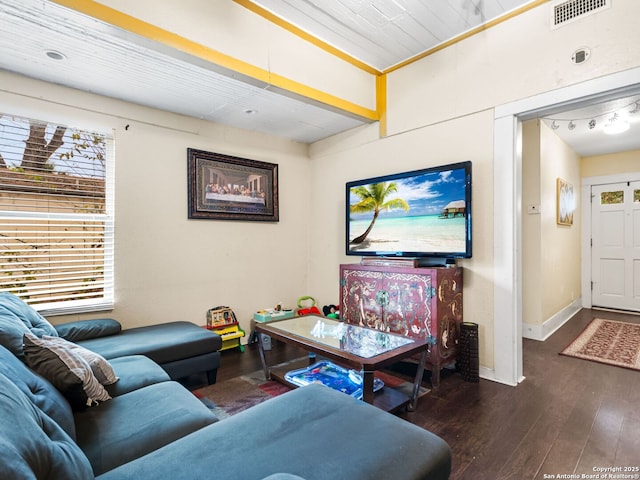 living room featuring wood ceiling, ornamental molding, and dark hardwood / wood-style floors