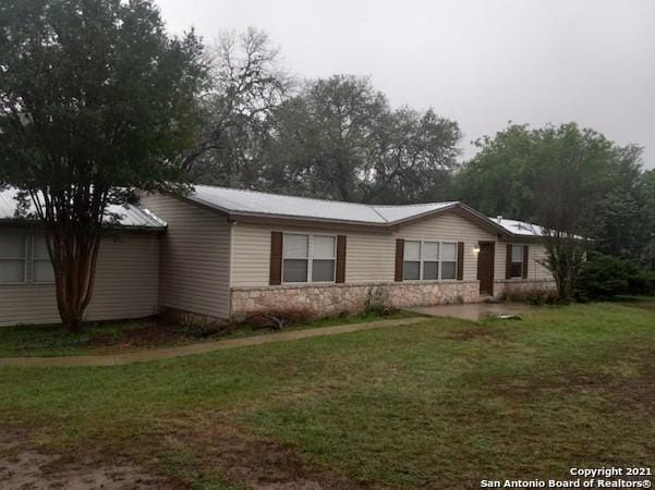 view of property exterior featuring a lawn