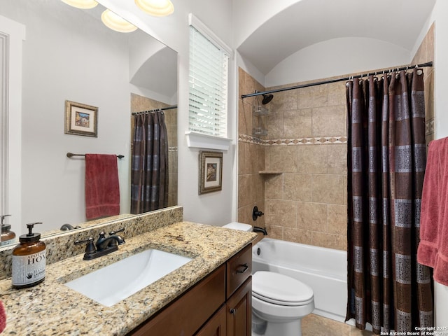 full bathroom with toilet, vanity, shower / bathtub combination with curtain, and vaulted ceiling