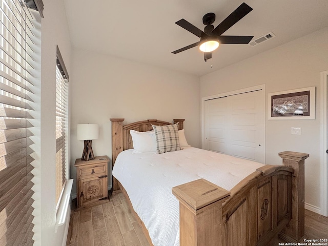 bedroom featuring ceiling fan and a closet