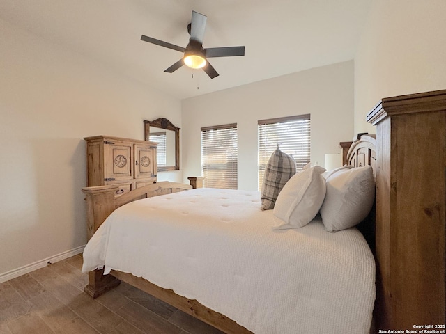 bedroom featuring multiple windows and ceiling fan