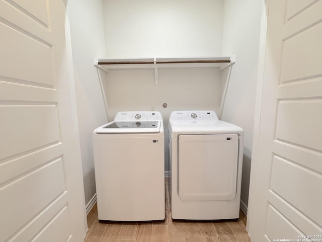 laundry room with washing machine and clothes dryer