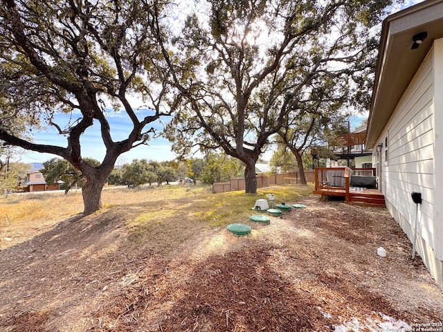 view of yard with a wooden deck