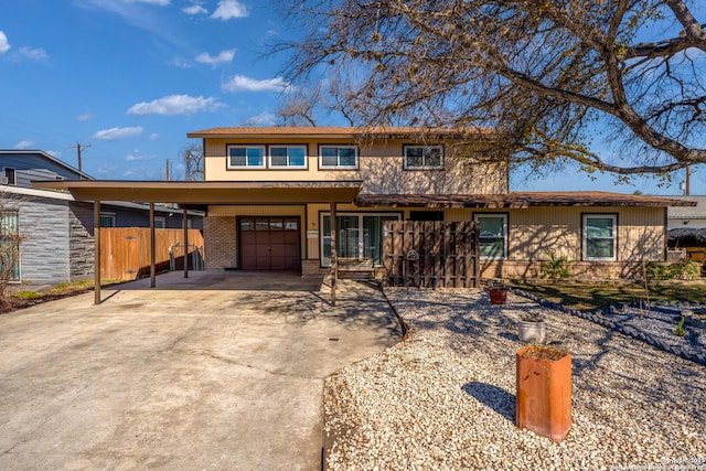 view of front of home with a carport and a garage