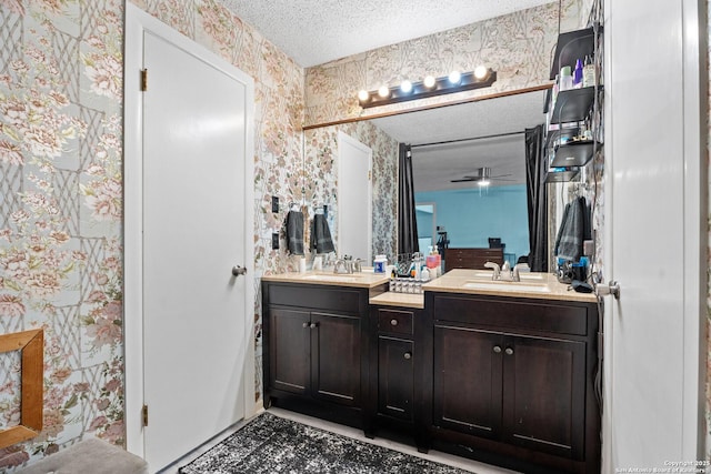 bathroom featuring vanity and a textured ceiling