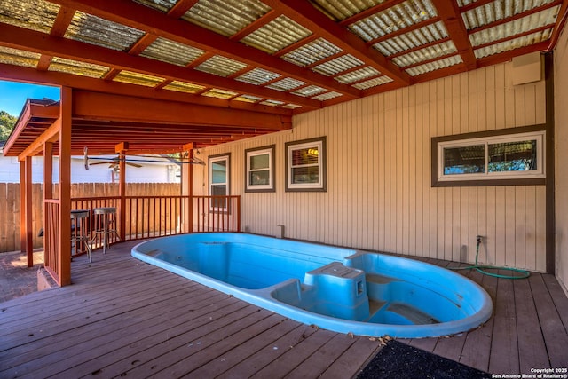 view of swimming pool with a wooden deck