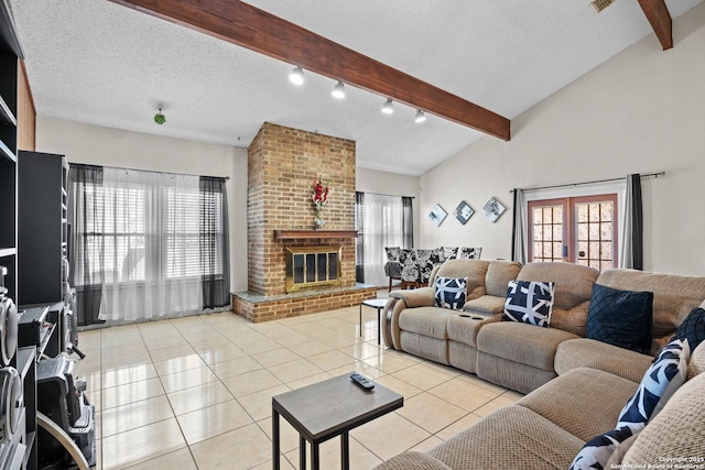 living room with french doors, lofted ceiling with beams, a textured ceiling, light tile patterned floors, and a fireplace