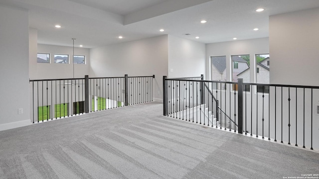 spare room with recessed lighting, carpet floors, and baseboards